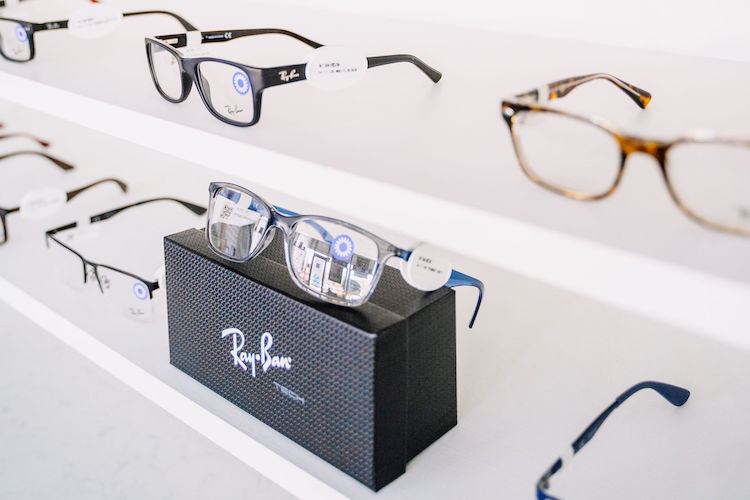 RayBans Glasses Displayed on White Shelves